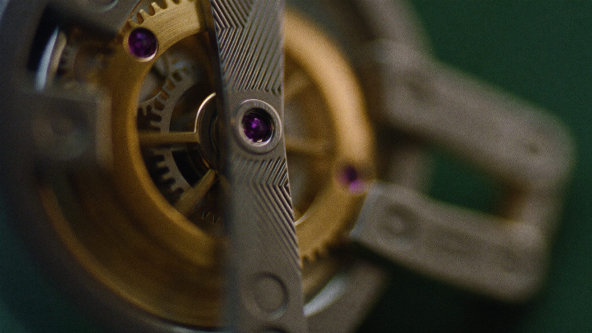 Mechanical watch floating in emerald darkness